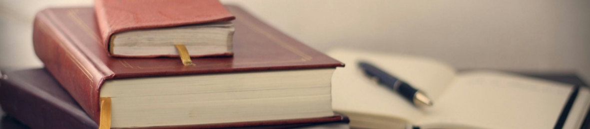 Legal books and compliance materials on a desk representing new legislation affecting employee Benefit Changes 2026.