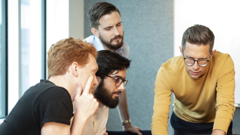 COBRA Blanket Notifications Business professionals collaborating on COBRA compliance, focusing on blanket notifications for employee benefits coverage.